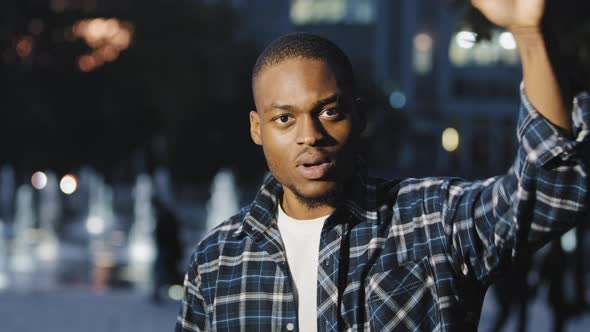 African American Man Hold Fist in Air alt