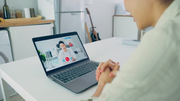 Asian young woman patient talking virtual online with medical doctor. alt