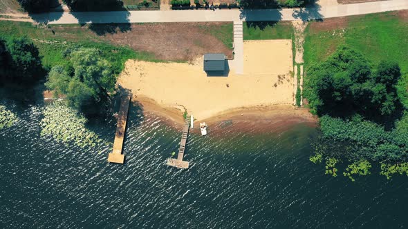 Epic Top Down Aerial View of Big Lake With Clear Blue Water. Reflection of Sky in Clear Lake in Even alt