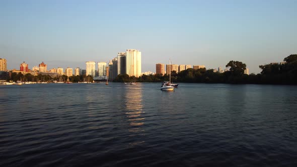 Aerial view of the modern sailboat sailing on the river Dnieper, Kyiv Ukraine alt