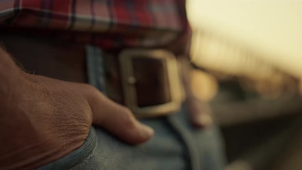 Agronomist Keep Hand Pocket Standing Near Combine at Sunset Field Closeup alt