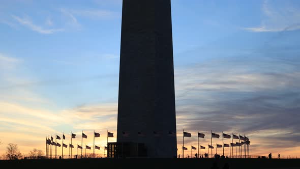 Washington Monument, American flags, tourists - DC - Sunset silhouette alt