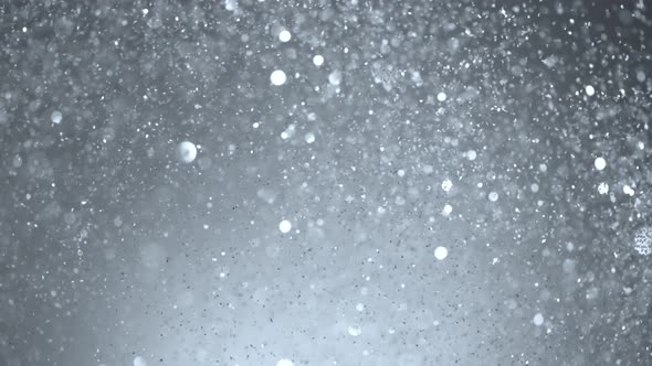 Super Slow Motion Shot of SIlver Glitter Background at 1000Fps alt