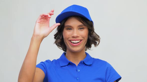 Portrait of Happy Delivery Woman in Blue Uniform alt