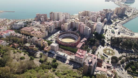 Topdown view Malaga bullring arena surrounded by residential buildings, Spanish coastline. Andalusia