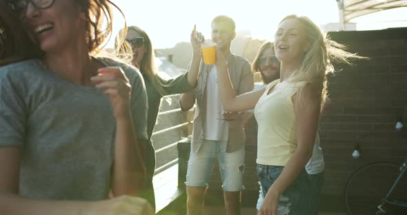 Happy Dancing People on Sunset Party