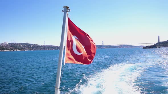 Turkish flag waving on the stern of an Istanbul Ship. Slow motion video. 