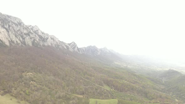 Veliki Krsh mountain in Eastern Serbia under fog 4K drone footage
