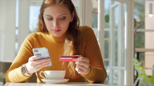 Beautiful Sunny Day Young Woman Drinks Morning Coffee in a Cafe, Making Online a Purchase Easy alt