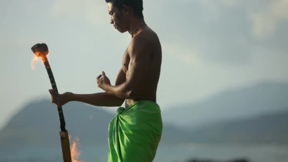 Hawaiian fire knife dancer performs alt