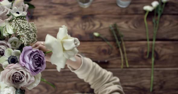 Young Florist Assembles a Rustic Wedding Bouquet