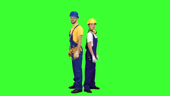 Guy with the Girl Builders, Stand Back To Back and Point at Their Friends, Green Screen alt