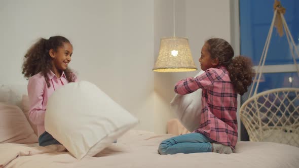 Black Preadolescent Sisters Pillow Fighting on Bed, Stock Footage ...