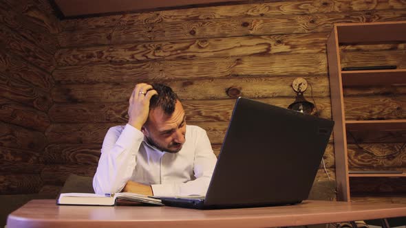 A Loser Businessman Calculates a Small Income in Dollars and Gets Upset alt