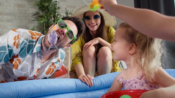 Video of father with children having fun while on vacation. Shot with RED helium camera in 8K. alt