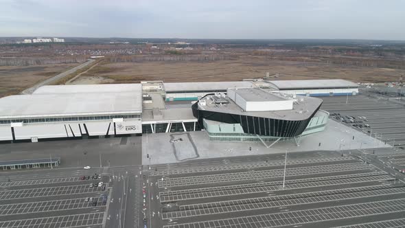 A huge building for conferences, exhibitions, concerts, forums with a large parking lot 06 alt