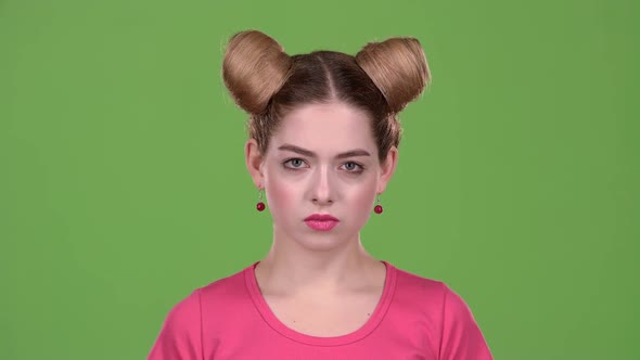 Teen Shows a Thumbs Down, She's Upset. Green Screen. Slow Motion alt