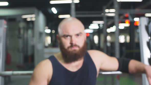 Powerlifter Posing in Underground Garage alt