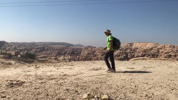 Man Tourist Hiker Walking By Desert Road in Petra Jordan