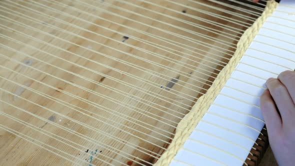  Woman's Hands Weaving on a Loom Frame and Fasten the Yarn with Scallop.