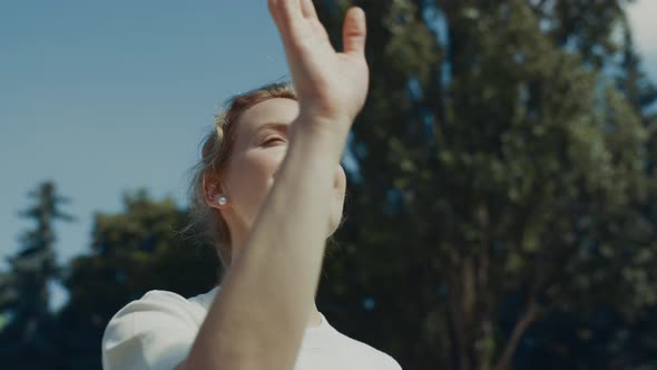 Beautiful Woman Sending Airkiss Saying Goodbye to Children Closeup alt