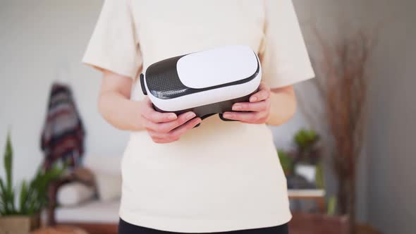 VR Headset in Women's Hands Close Up