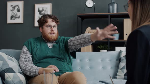 Weird Man Getting Psychological Help During Session with Female Therapist alt