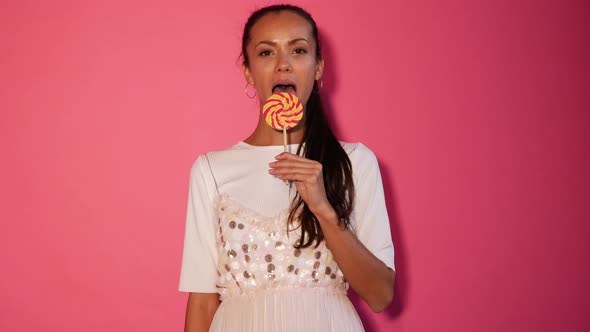 Closeup portrait of sexy girl eating lollipop alt