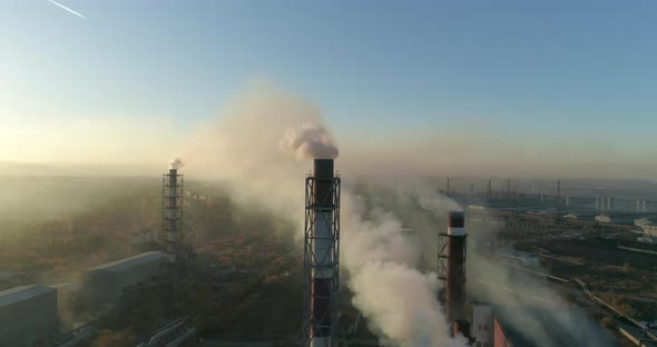 Air Pollution. Smoke Coming from the Smokestacks of the Plant Smoking Chimneys of a Steel Factory alt
