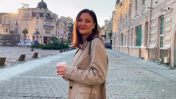 Happy Female With Coffee at the Morning