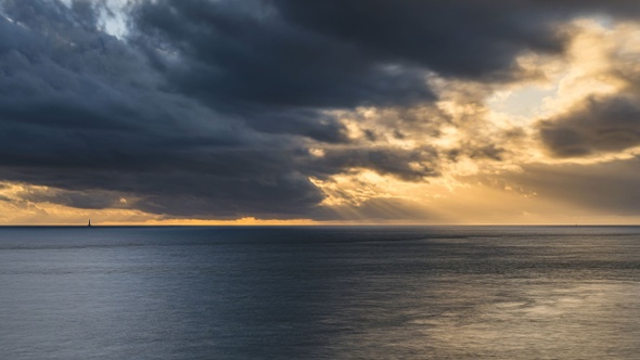 Timelapse Sunset with Light Rays above ocean with Cordouan Light House, France alt