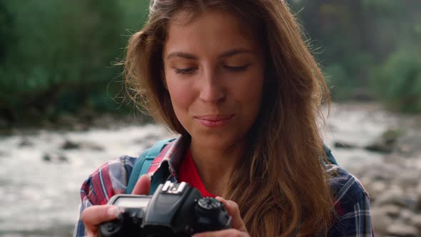 Hiker Using Photo Camera During Hike alt