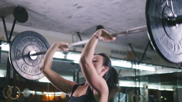 Strong Young Woman Lifting Heavy Weights at Gym Slow Motion alt