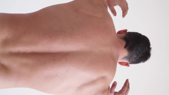 Athletic Man Suffers From Back Pain alt