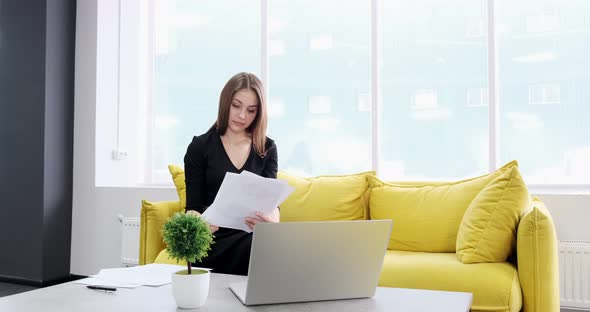 Concerned Woman Working and Thinking Solving Problem at Office. Serious Attractive Female Working alt