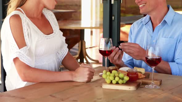 Man giving engagement ring to surprised woman 4k alt