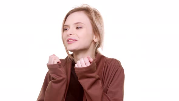 Surprised Beautiful Caucasian Teenager Girl Rejoicing and Looking Gratefully at Camera Standing on alt