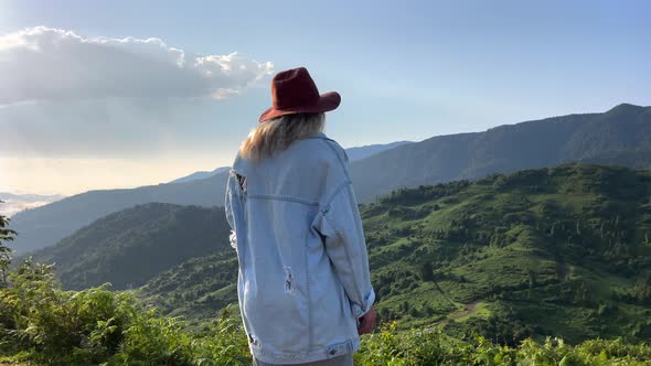 Woman Enjoying Mountain View on Sunrise