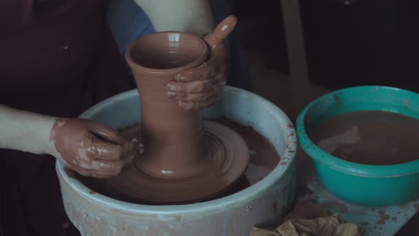 Potter Working on Clay Jug