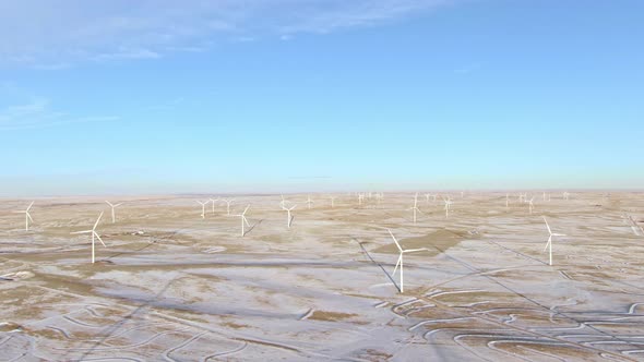 Aerial shots of wind turbines on a cold winter afternoon in Calhan, Colorado alt