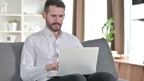Face of Serious Young Man Looking at the Camera alt