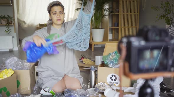 Girl Blogger Shoots Video Showing Different Waste Materials