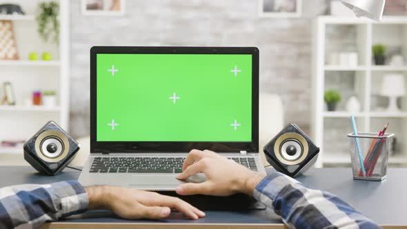 Man Hands Scrolling on Laptop with Green Screen Isolated Mock Up Display alt