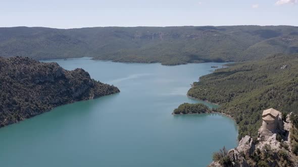 Picturesque rocky mountains near peaceful lake alt