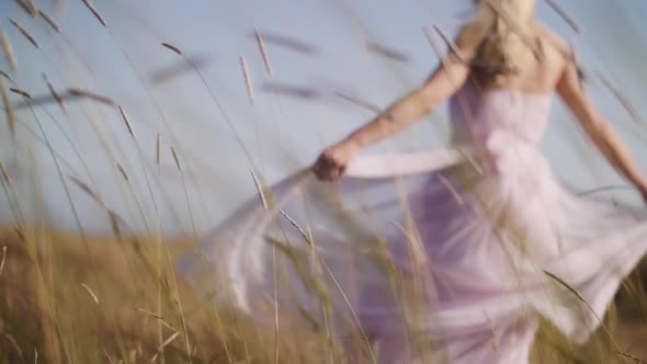 the dress develops in the wind at the lighthouse alt