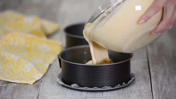 Pouring Batter Into Cake Pans