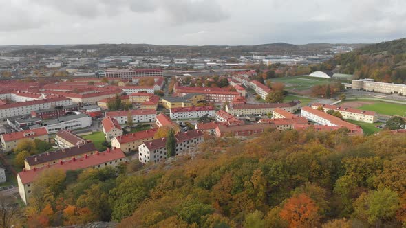Gamlestaden Urban District in Gothenburg Autumn Foliage Reveal Aerial Rising alt