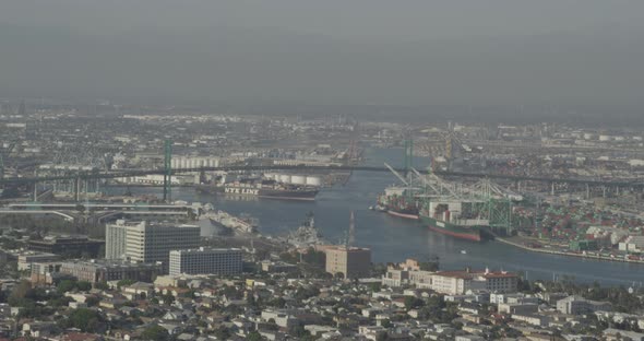 Steady helicopter aerial of mountains at sunset alt