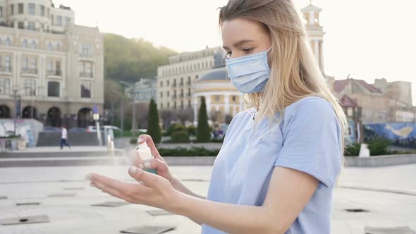 Woman Using Spray Dispenser