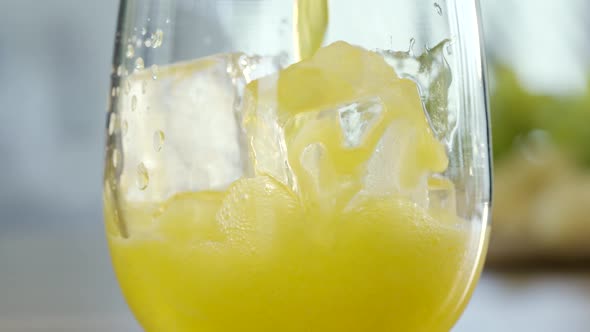 Orange Soda Drink Poured On Ice Cubes
